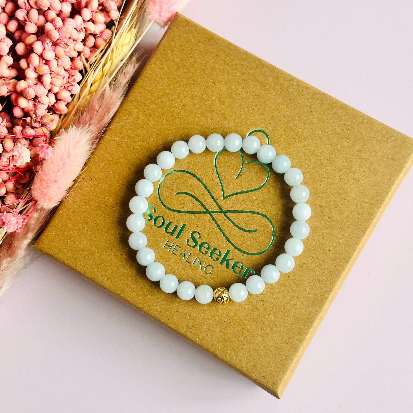 Aquamarine bracelet with a faceted sterling silver or gold vermeil focal bead. A bracelet for eternal youth. Made with 6mm beads.