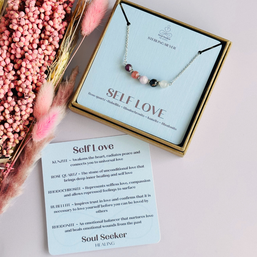 A dainty self love crystal necklace made with a selection of five healing crystals all believed to help promote self love. On a fine, sterling silver figaro chain, which fastens with a sterling silver bolt clasp. Featuring corrugated sterling silver spacer beads and accented with daisy shaped bead caps.