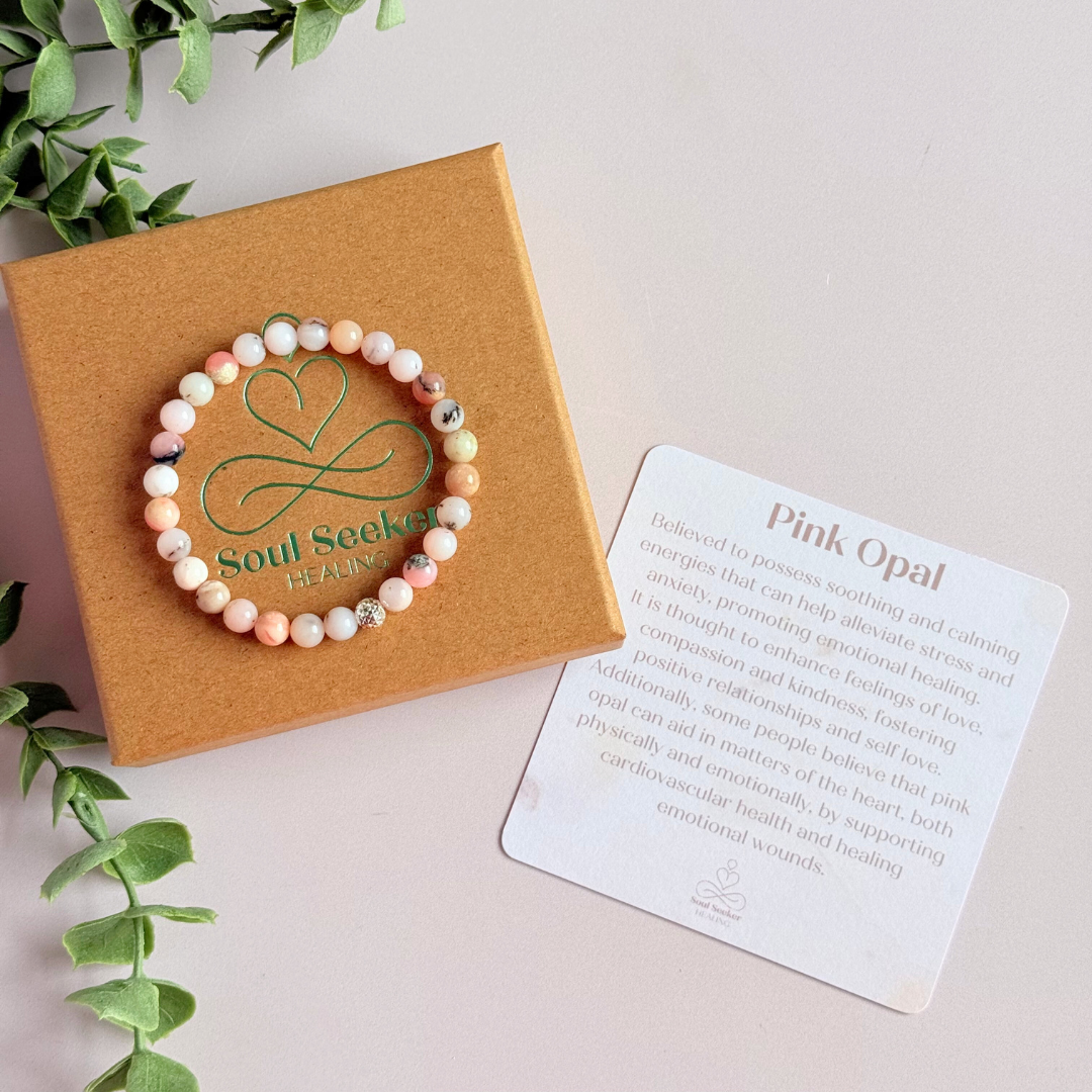 Pink opal bracelet featuring 6mm genuine round pink opal beads, with one faceted gold vermeil 6mm bead as the focal point. Elasticated for comfort.