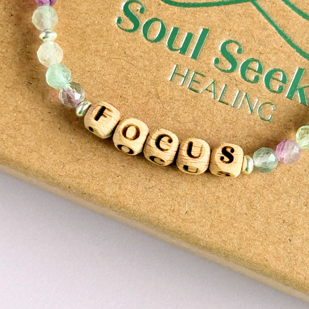 Bracelet featuring 5mm engraved wooden beads, which you can personalise with your choice of words, numbers and symbols. The main the band of the bracelet is made with 4mm faceted fluorite round crystal gemstone beads. Finished with your choice of gold vermeil, sterling silver or rose gold vermeil accent beads.