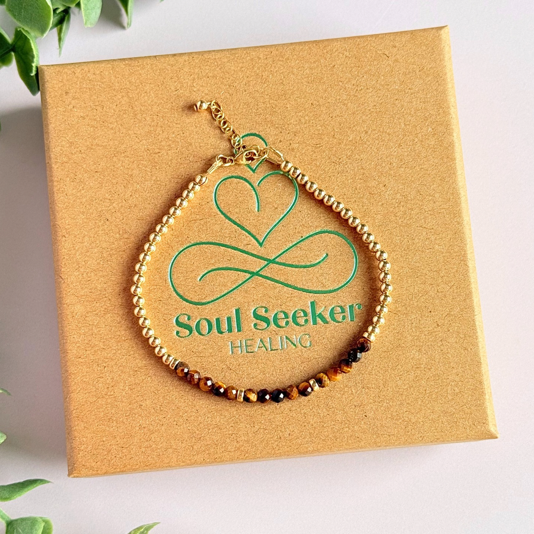 Dainty minimalist yellow gold filled crystal bracelet featuring 3mm faceted tigers eye beads with 3mm gold filled beads. Fastens with a gold filled lobster clasp with an extender chain.