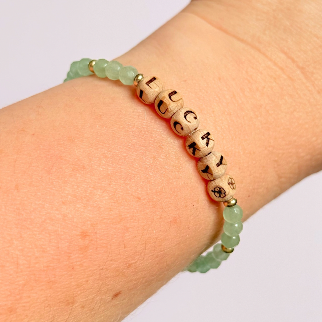 Bracelet featuring 5mm engraved wooden beads which you can personalise with your choice of words, numbers and symbols. The main the band of the bracelet is made with 4mm faceted green aventurine round crystal gemstone beads. Finished with your choice of gold vermeil, sterling silver or rose gold vermeil accent beads.