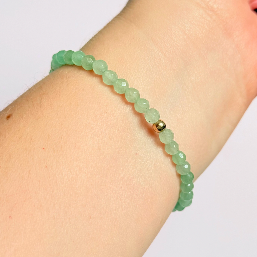 Bracelet featuring 5mm engraved wooden beads which you can personalise with your choice of words, numbers and symbols. The main the band of the bracelet is made with 4mm faceted green aventurine round crystal gemstone beads. Finished with your choice of gold vermeil, sterling silver or rose gold vermeil accent beads.