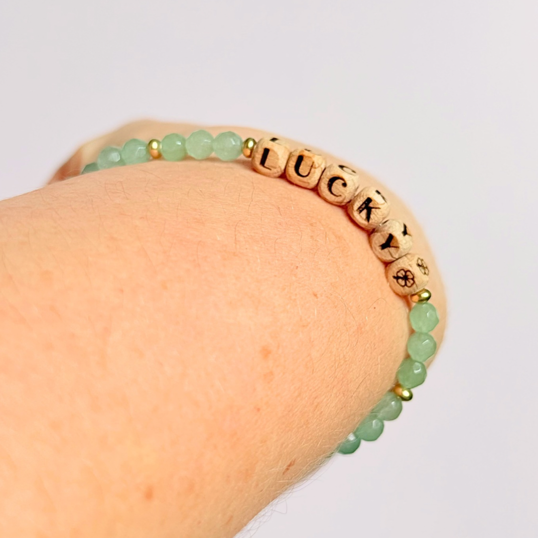 Bracelet featuring 5mm engraved wooden beads which you can personalise with your choice of words, numbers and symbols. The main the band of the bracelet is made with 4mm faceted green aventurine round crystal gemstone beads. Finished with your choice of gold vermeil, sterling silver or rose gold vermeil accent beads.