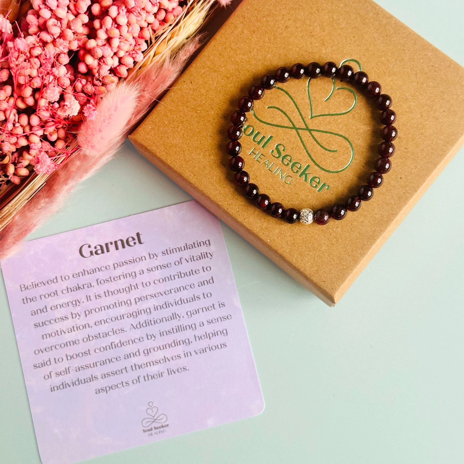 Garnet bracelet with a faceted sterling silver or gold vermeil focal bead. A bracelet for passion, success and confidence. Made with 6mm beads.