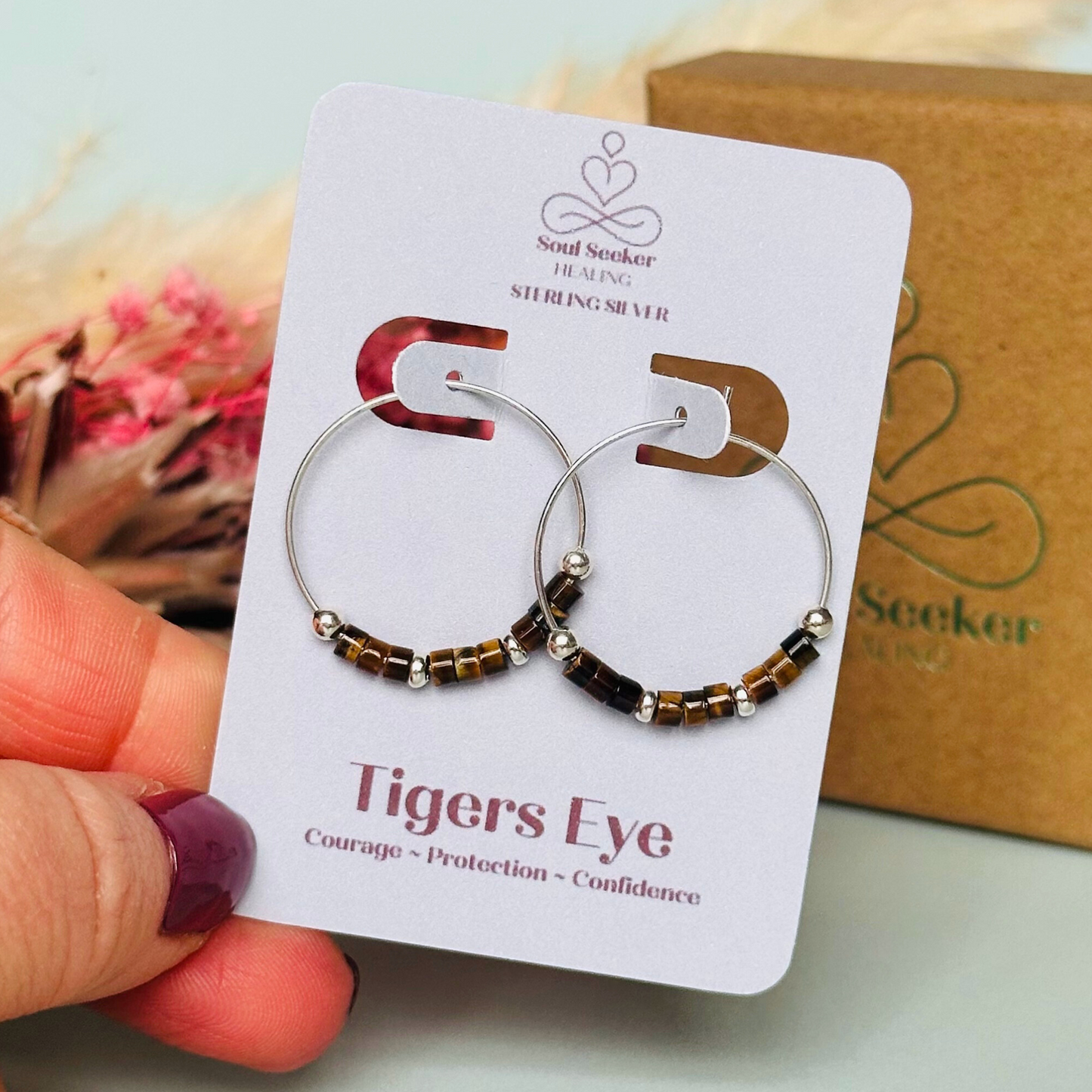 Tigers eye sterling silver hoop earrings with ethically mined tigers eye heishi beads on 25mm sterling silver hoops.