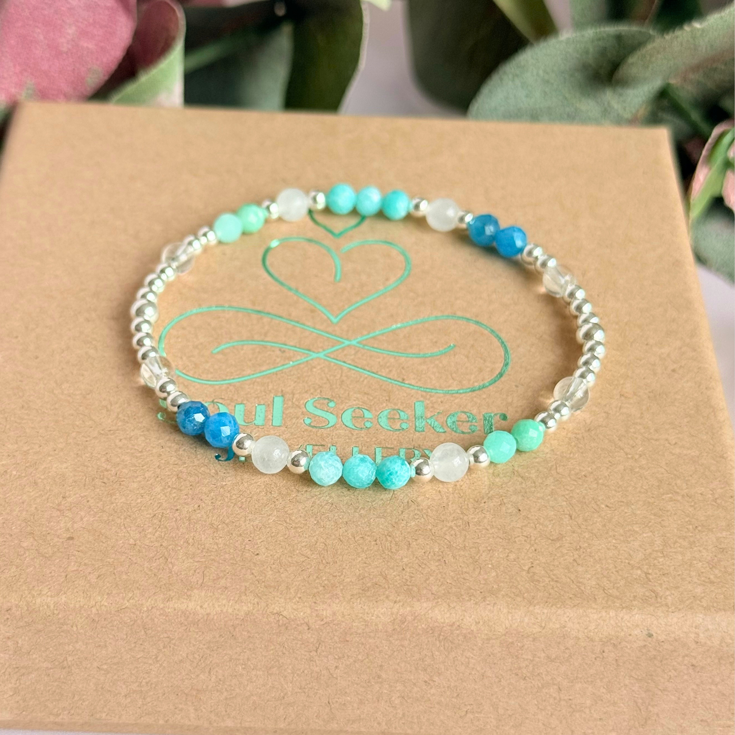 ‘Caribbean Dream' sterling silver dainty beaded bracelet with white jade, chrysoprase, amazonite, apatite and clear quartz. Made with round 3mm sterling silver beads and 4mm smooth and faceted round crystal gemstone beads. Pictured on the box