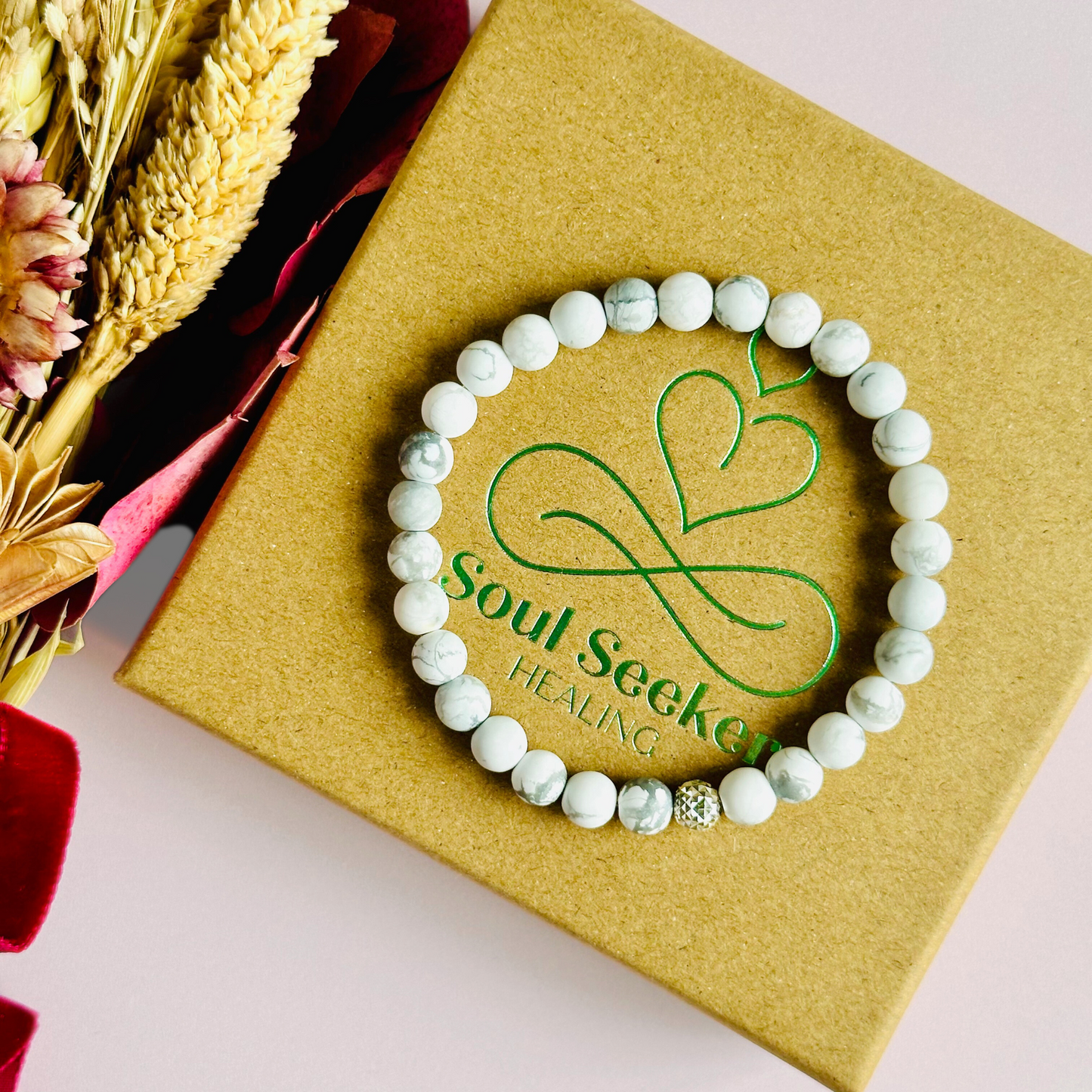 This howlite bracelet is made with ethically mined frosted howlite smooth crystal beads and features your choice of a sterling silver or gold vermeil faceted focal bead. A bracelet for emotional healing, calm and memory. All beads are 6mm.