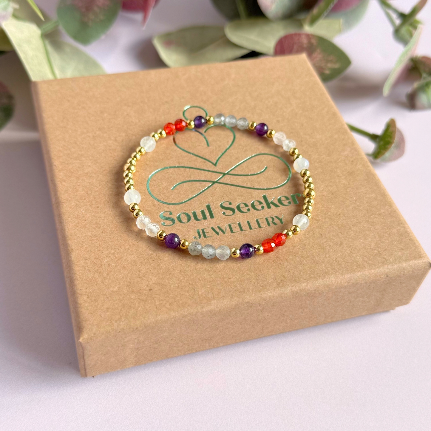 Dainty gold vermeil crystal bracelet featuring five crystals, in 4mm faceted and smooth round style, each believed to help with hormonal balance. Featuring amethyst, moonstone, carnelian, labradorite and rose quartz. Pictured on the gift box.