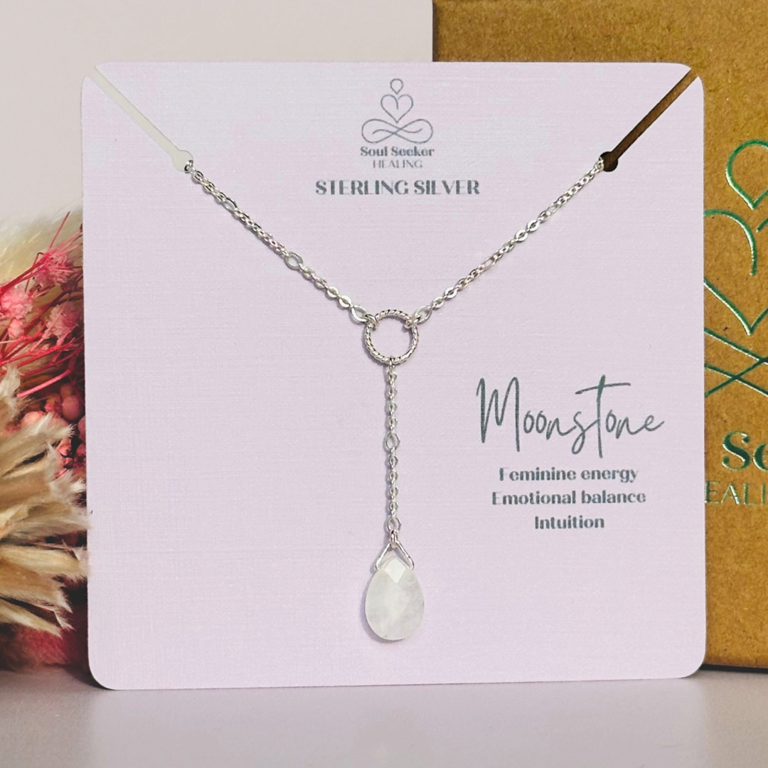Moonstone necklace features a faceted moonstone teardrop bead on a delicate sterling silver figaro chain with a twisted sterling silver ring focal point. The necklace fastens with a subtle yet secure sterling silver bolt clasp. The teardrop bead measures 12mm x 8mm.