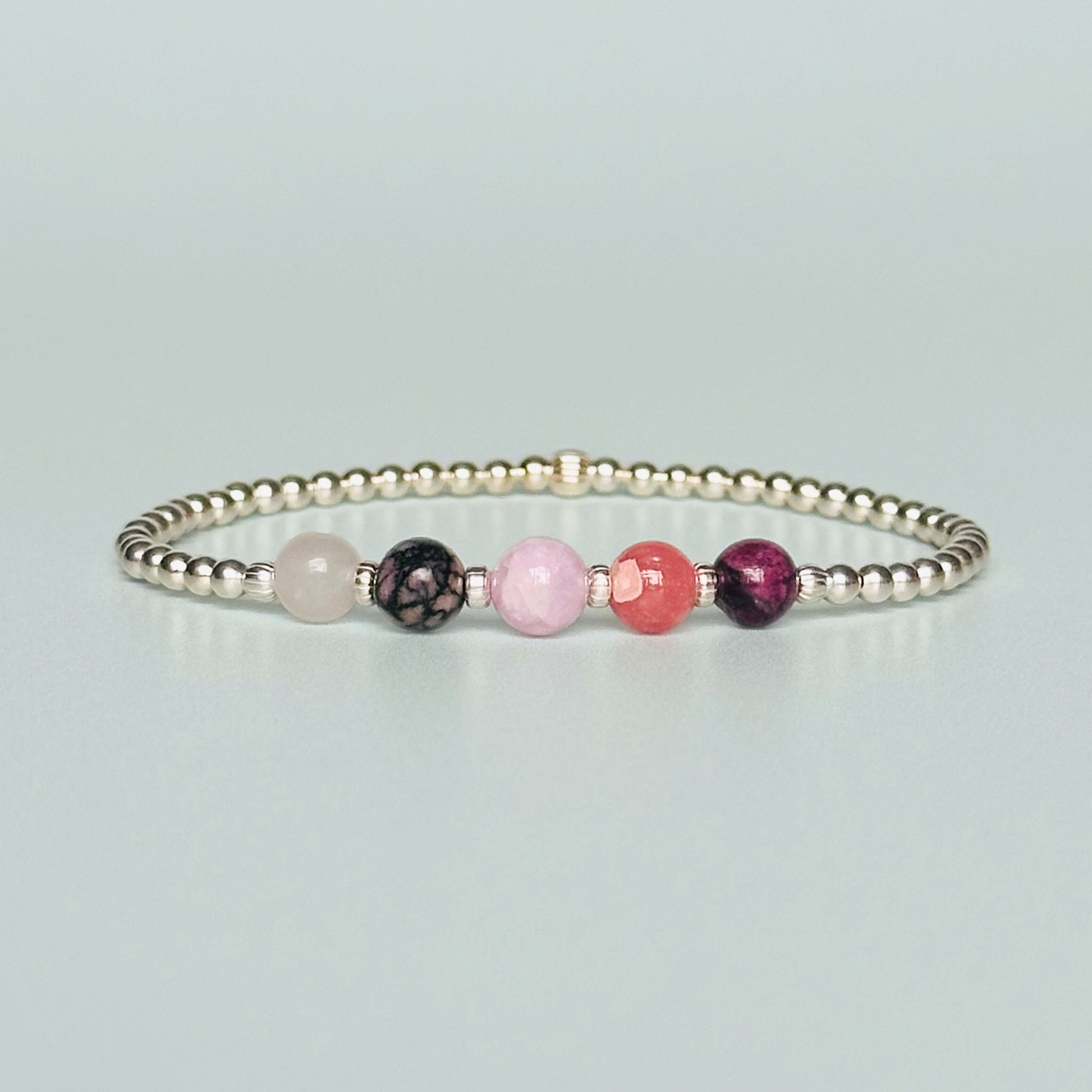 This sterling silver self love bracelet is made with a selection of five healing crystals all believed to help in achieving self love. The crystal beads are all 6mm and are on a band of 3mm sterling silver beads with corrugated accent beads.