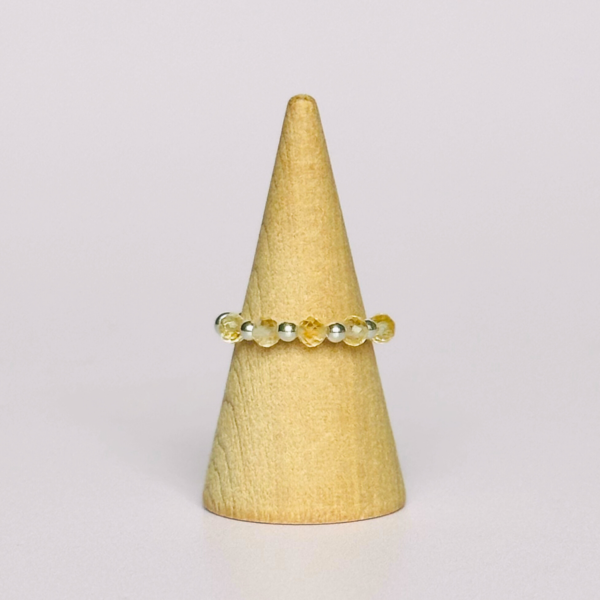 Citrine ring featuring five faceted 3mm citrine beads on a sterling silver elasticated band. November birthday ideas, November birthday gift, November birthstone ring, stretch ring, November jewellery, born in November, November woman