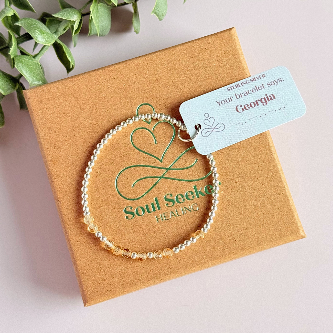Morse code secret message bracelet spelling out your chosen name in sterling silver and citrine crystal beads. Elasticated with 4mm faceted citrine beads and 3mm sterling silver beads. Custom November birthstone bracelet.
