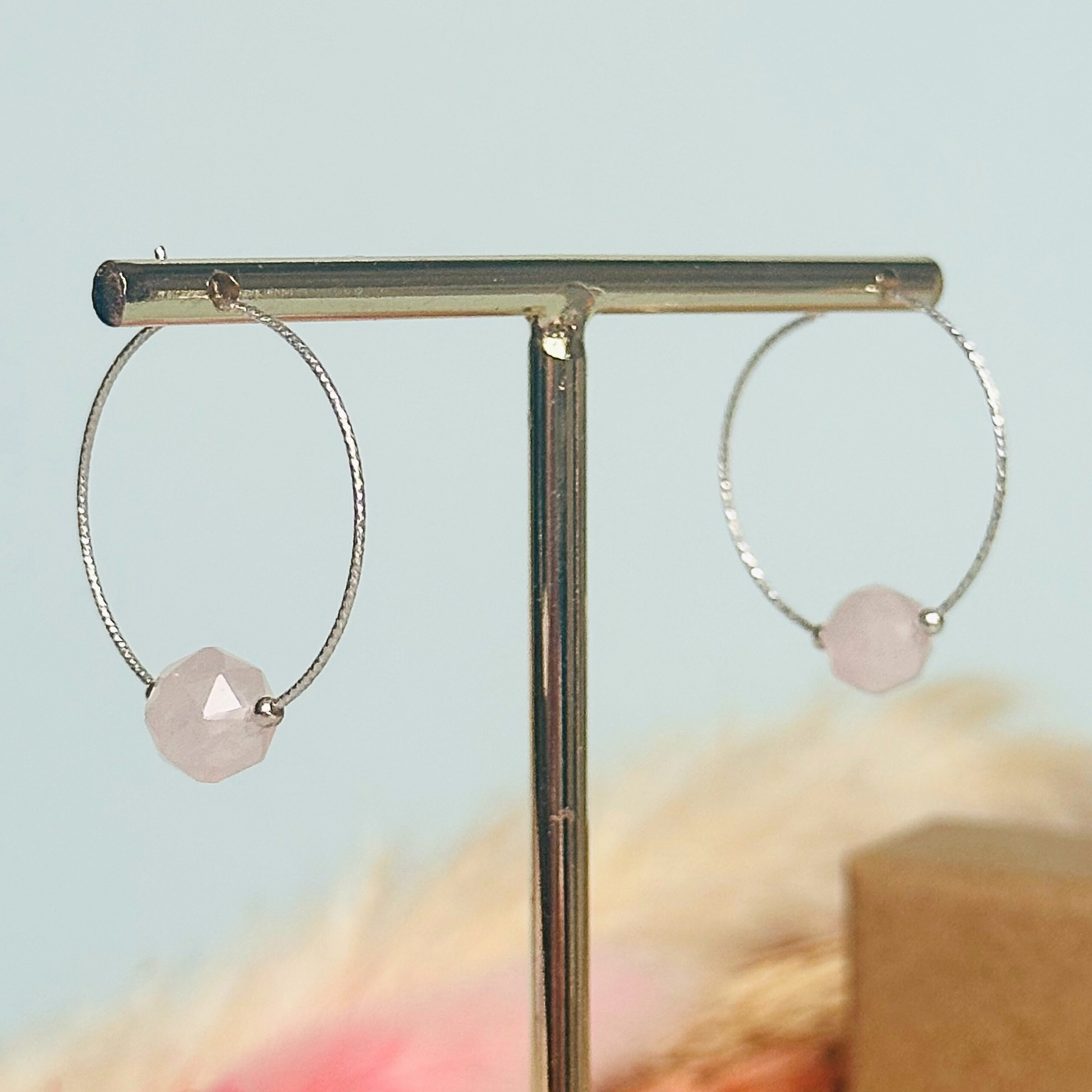 Rose Quartz sterling silver hoop earrings featuring 8mm star cut rose quartz beads on 25mm sparkle cut sterling silver hoops.