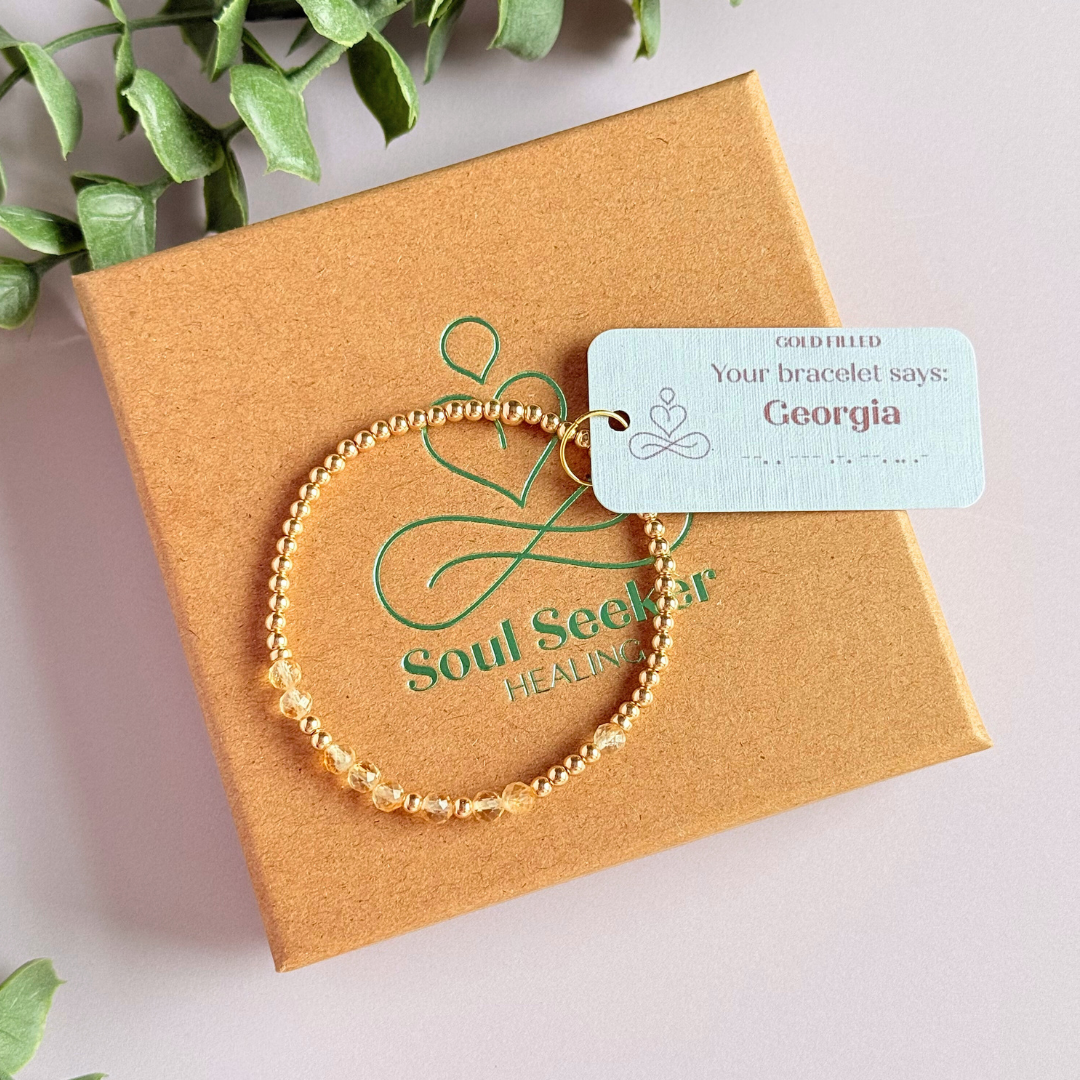 Morse code secret message bracelet spelling out your chosen name in gold filled and citrine crystal beads. Elasticated with 4mm faceted citrine beads and 3mm gold filled beads. Custom November birthstone bracelet.