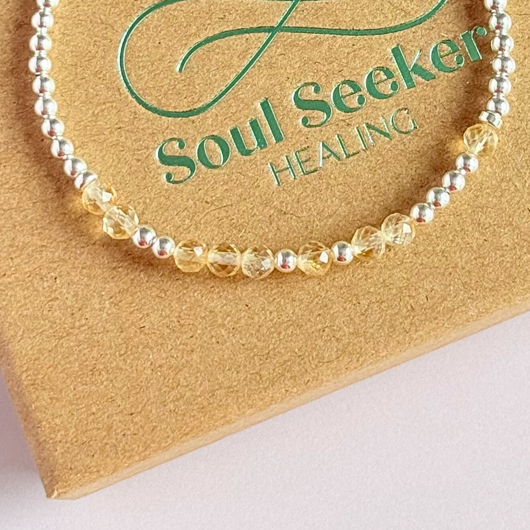 Morse code secret message bracelet spelling out your chosen name in sterling silver and citrine crystal beads. Elasticated with 4mm faceted citrine beads and 3mm sterling silver beads. Custom November birthstone bracelet.