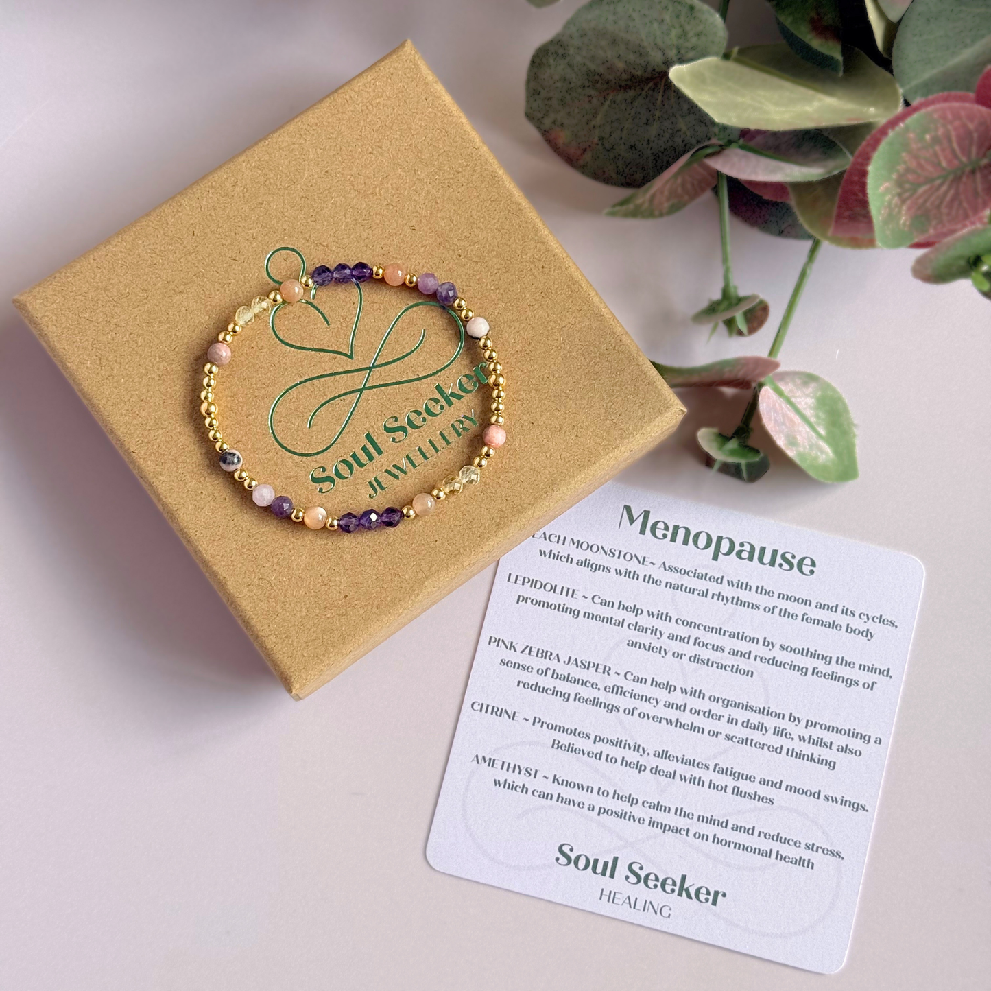 Dainty gold vermeil crystal bracelet featuring five crystals, in 4mm faceted and smooth round style, each believed to help with menopause symptoms. Featuring amethyst, citrine, lepidolite, peach moonstone and pink zebra jasper. Pictured with gift box and information card.