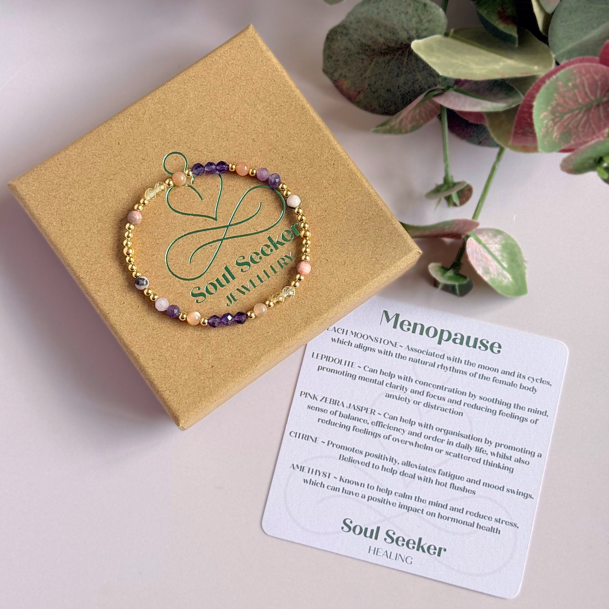 Dainty gold vermeil crystal bracelet featuring five crystals, in 4mm faceted and smooth round style, each believed to help with menopause symptoms. Featuring amethyst, citrine, lepidolite, peach moonstone and pink zebra jasper. Pictured with gift box and information card.