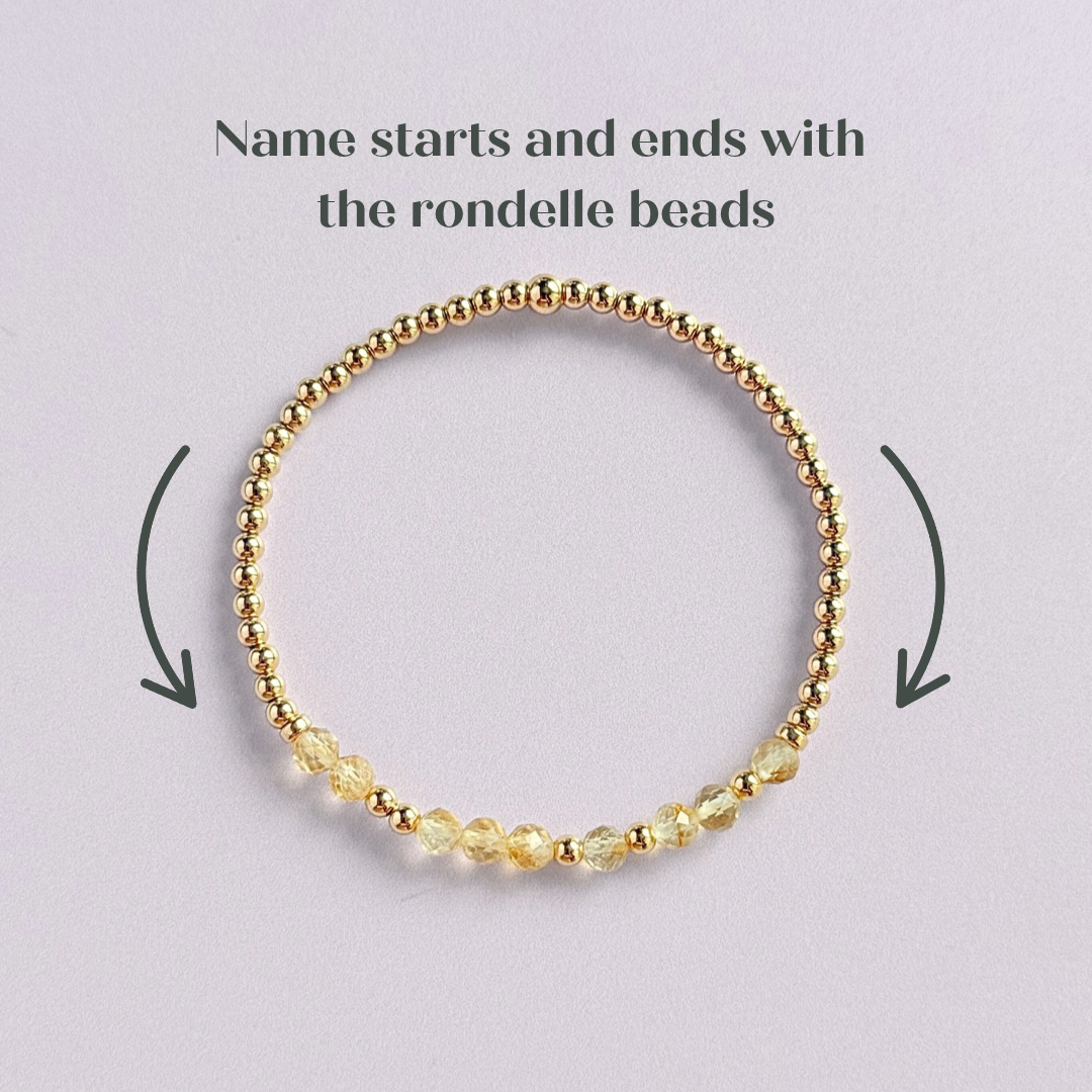 Morse code secret message bracelet spelling out your chosen name in gold filled and citrine crystal beads. Elasticated with 4mm faceted citrine beads and 3mm gold filled beads. Custom November birthstone bracelet.
