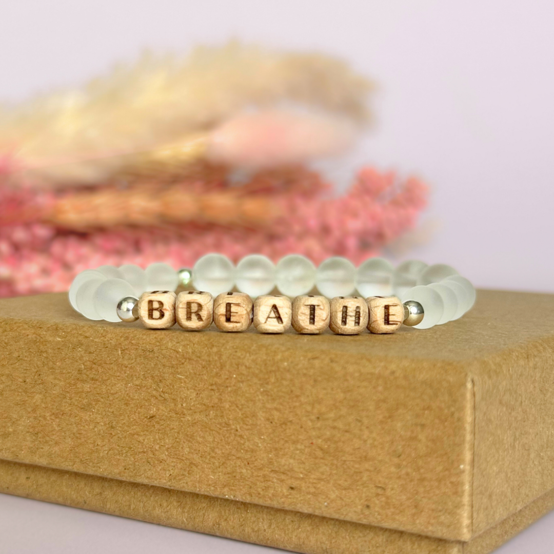 Breathwork bracelet featuring 6mm and 8mm frosted clear quartz crystal beads that follow the 4-7-8 counted breathing method. Also featuring laser engraved wooden letter beads spelling out the word BREATHE. Choose your accent beads from rose gold vermeil, gold vermeil or sterling silver.
