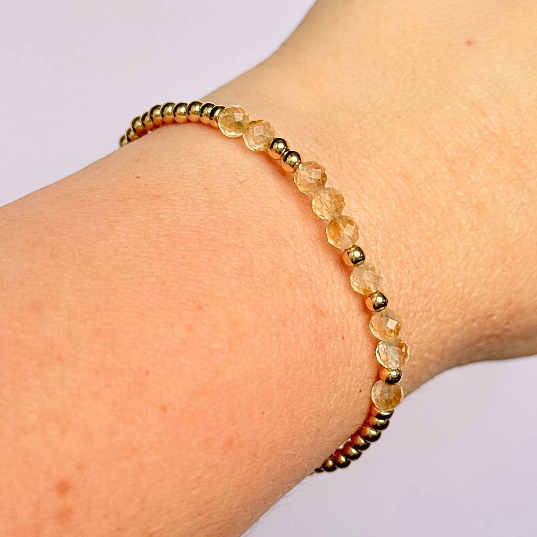 Morse code secret message bracelet spelling out your chosen name in gold filled and citrine crystal beads. Elasticated with 4mm faceted citrine beads and 3mm gold filled beads. Custom November birthstone bracelet.