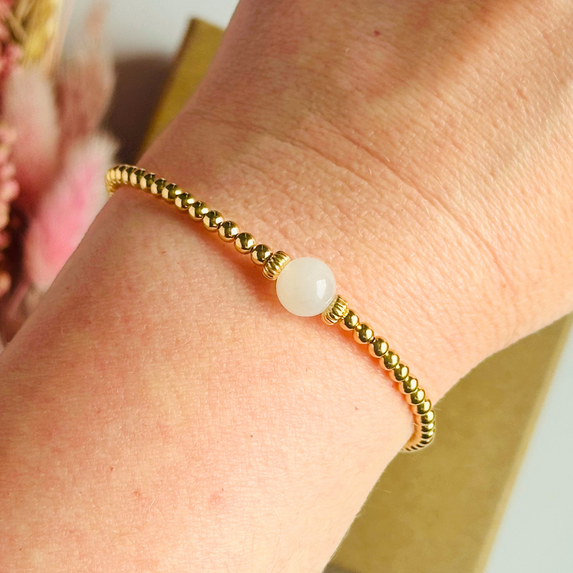 Gold vermeil moonstone bracelet features an ethically mined 8mm moonstone bead, flanked by corrugated rondelle beads on a band of 3mm gold vermeil beads. A bracelet to promote feminine energy and intuition.