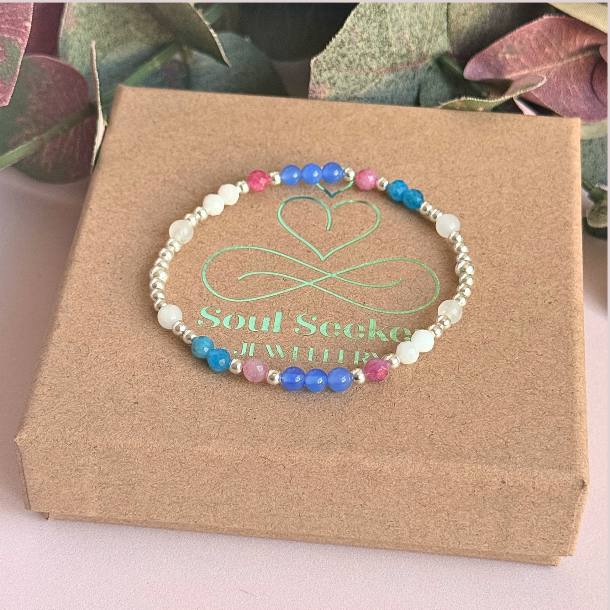 ‘Santorini' sterling silver dainty beaded bracelet with pink tourmaline, rainbow moonstone, blue agate, apatite and white jade. Made with round 3mm sterling silver beads and 4mm smooth and faceted round crystal gemstone beads. Pictured on the gift box