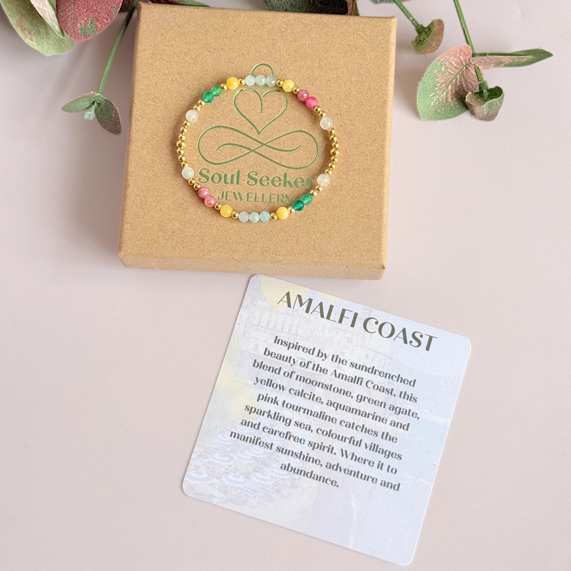 'Amalfi Coast' gold vermeil dainty beaded bracelet with green agate, yellow calcite, pink tourmaline, aquamarine and moonstone. Made with round 3mm gold vermeil beads and 4mm smooth and faceted round crystal gemstone beads. Pictured on the box, with the crystal information card