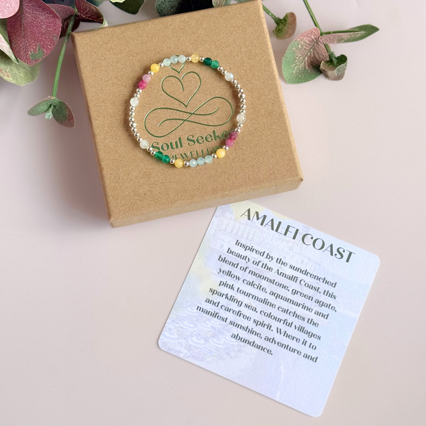 'Amalfi Coast' sterling silver dainty beaded bracelet with green agate, yellow calcite, pink tourmaline, aquamarine and moonstone. Made with round 3mm sterling silver beads and 4mm smooth and faceted round crystal gemstone beads. Pictured on the box, with the crystal information card