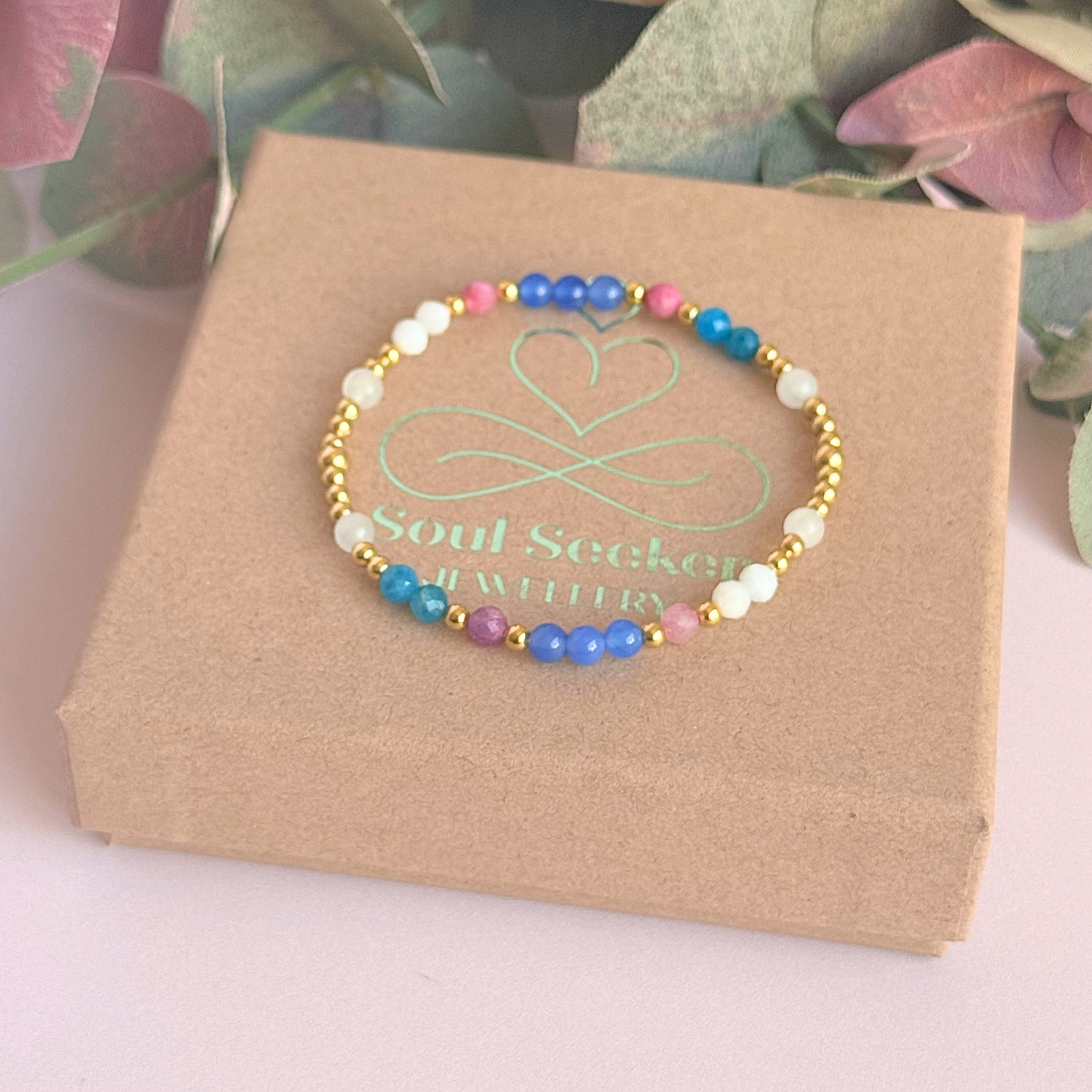 ‘Santorini' gold vermeil dainty beaded bracelet with pink tourmaline, rainbow moonstone, blue agate, apatite and white jade. Made with round 3mm gold vermeil beads and 4mm smooth and faceted round crystal gemstone beads. Pictured onto of the gift box