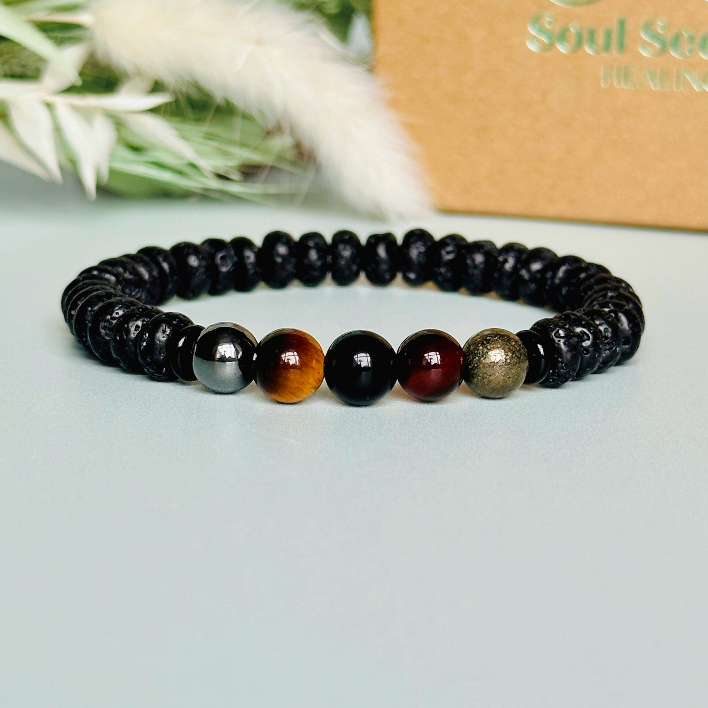 Mens crystal bracelet made with black lava beads and 8mm hematite, sardonyx, tigers eye, black obsidian and pyrite beads. All crystals are believed to be great crystals for men and make a great gift for him. Bracelet for men.