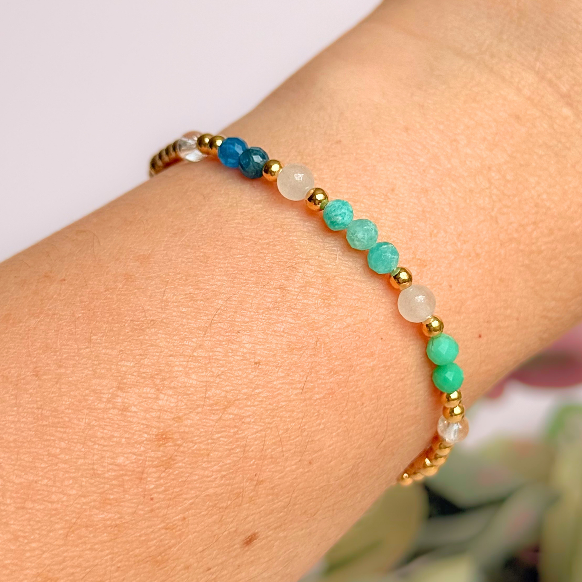 ‘Caribbean Dream' gold vermeil dainty beaded bracelet with white jade, chrysoprase, amazonite, apatite and clear quartz. Made with round 3mm gold vermeil beads and 4mm smooth and faceted round crystal gemstone beads. Pictured being worn
