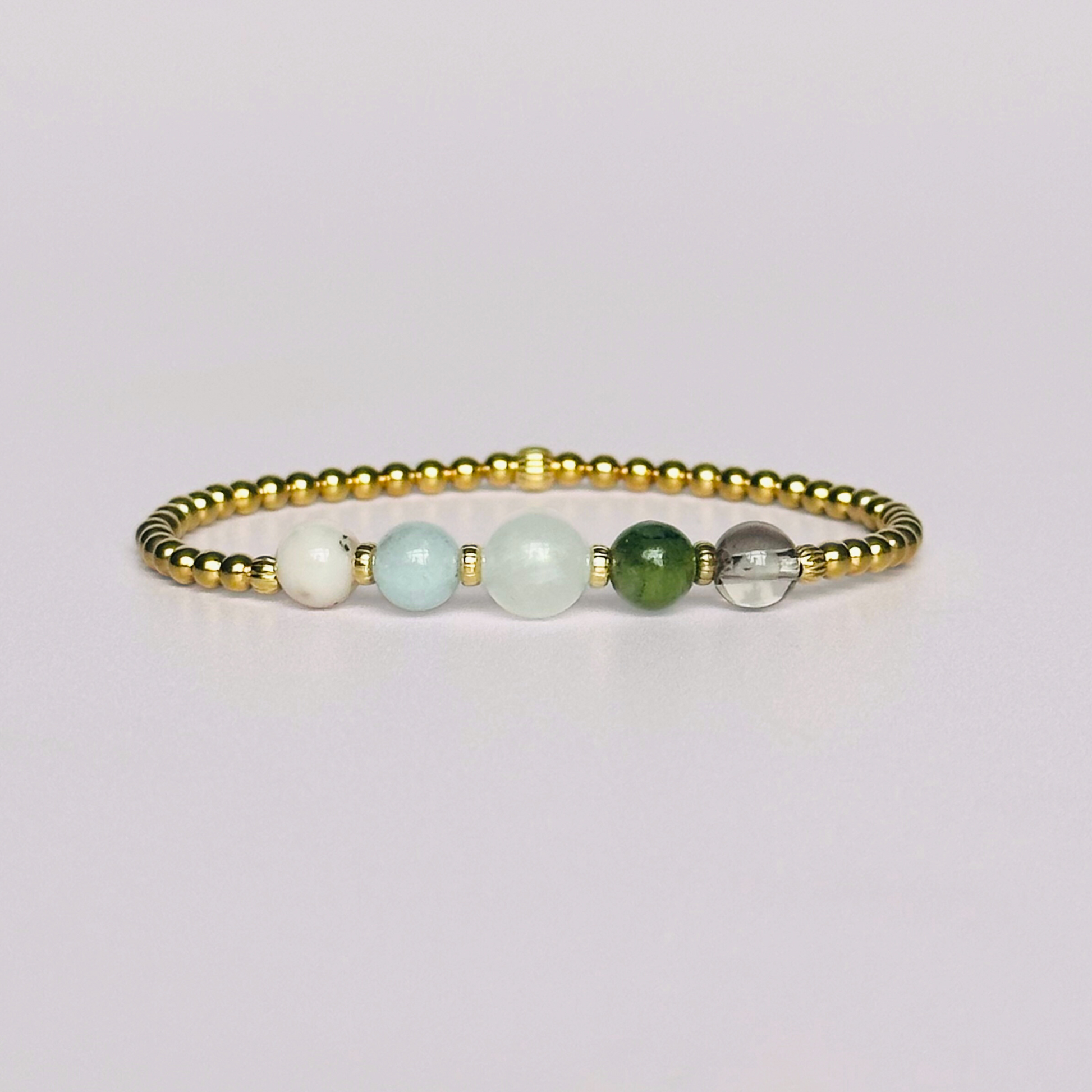 This gold vermeil Virgo bracelet is made with a selection of five healing crystals all believed to resonate with the Virgo zodiac sign. The central bead is 8mm, the other four are 6mm. On an elasticated band of 3mm gold vermeil beads with corrugated accent beads. Featuring amazonite, carnelian, moonstone, moss agate and sardonyx.