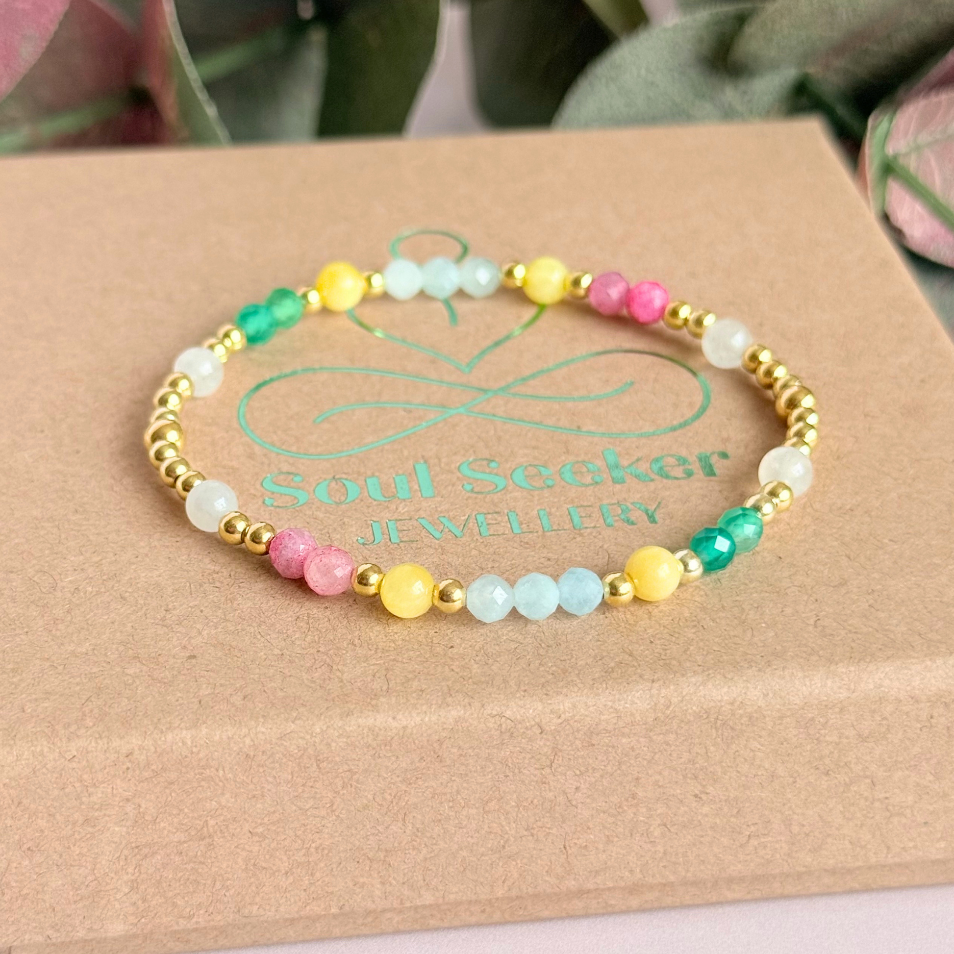 'Amalfi Coast' gold vermeil dainty beaded bracelet with green agate, yellow calcite, pink tourmaline, aquamarine and moonstone. Made with round 3mm gold vermeil beads and 4mm smooth and faceted round crystal gemstone beads. Pictured on the box