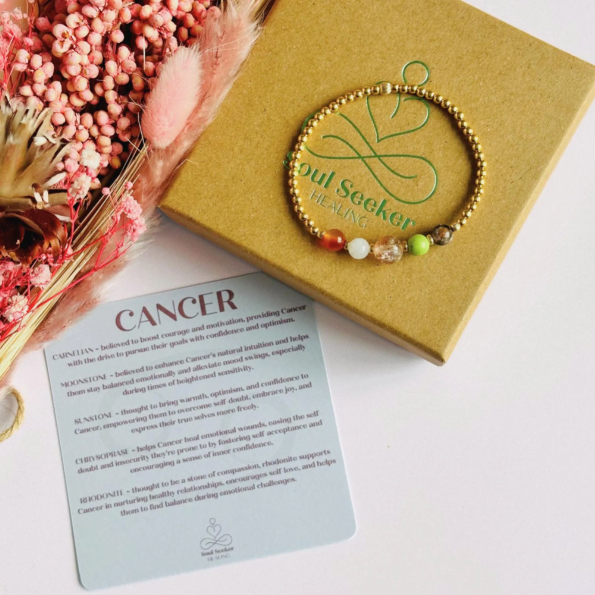 This gold vermeil Cancer bracelet is made with a selection of five healing crystals all believed to resonate with the Cancer zodiac sign. The central bead is 8mm, the other four are 6mm. On an elasticated band of 3mm gold vermeil beads with corrugated accent beads. Featuring chrysoprase, rhodonite, sunstone, moonstone and carnelian.