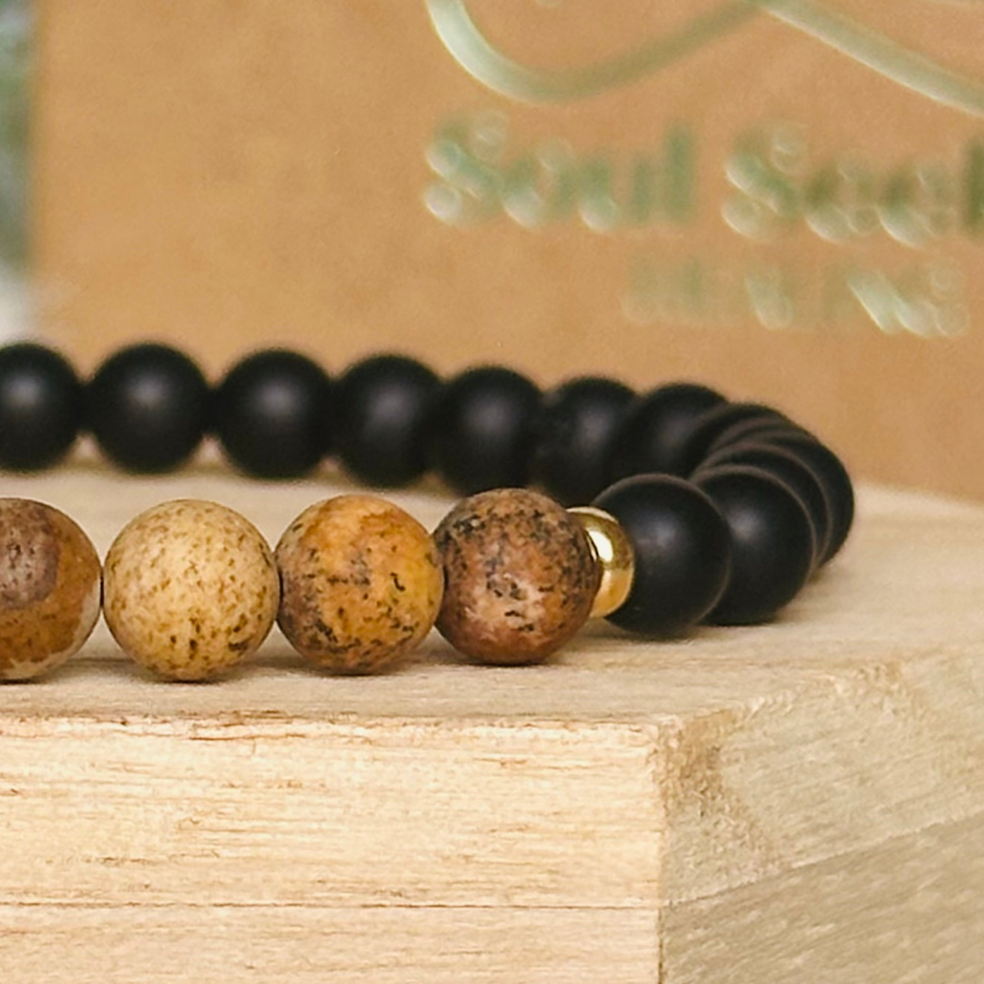 Men’s crystal bracelet featuring 6mm matte black onyx beads, 6mm matte picture jasper beads with gold vermeil spacer beads.