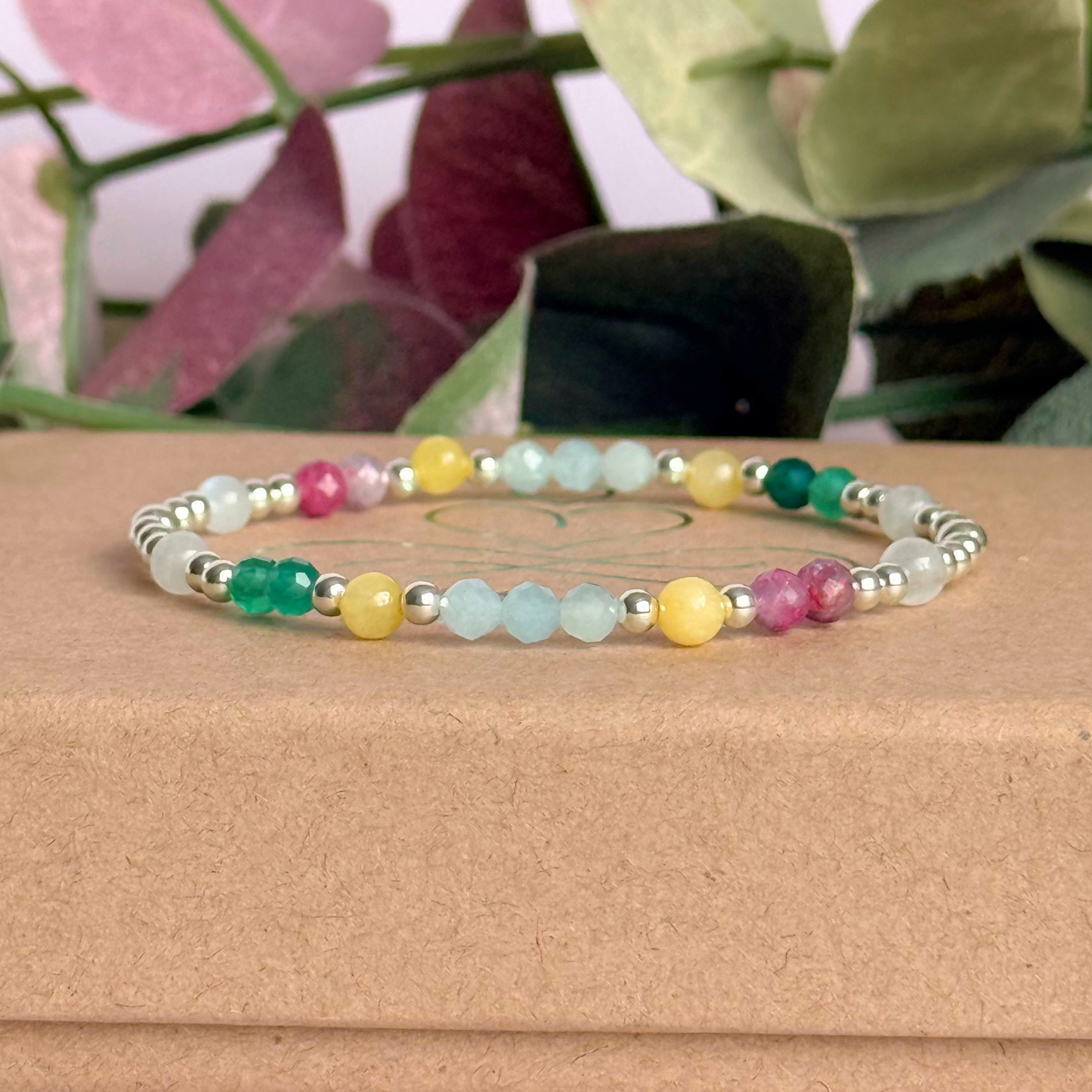 'Amalfi Coast' sterling silver dainty beaded bracelet with green agate, yellow calcite, pink tourmaline, aquamarine and moonstone. Made with round 3mm sterling silver beads and 4mm smooth and faceted round crystal gemstone beads. Pictured on the box
