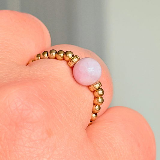 Crystal ring with a 6mm kunzite round bead on an elasticated ring band of 2.5mm gold vermeil ball beads.