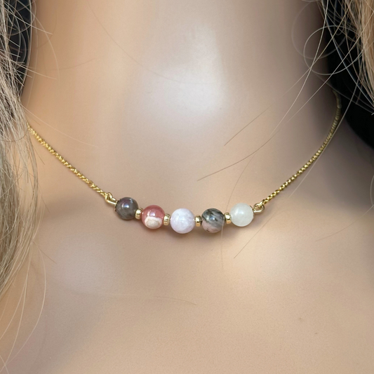 A dainty self love crystal necklace made with a selection of five healing crystals all believed to help promote self love. On a fine, gold vermeil figaro chain, which fastens with a gold vermeil bolt clasp. Featuring corrugated gold vermeil spacer beads and accented with daisy shaped bead caps.