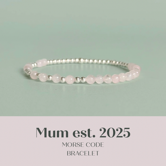Morse code secret message bracelet spelling out the words Mum est. 2025 in sterling silver and rose quartz crystal beads. elasticated with 4mm rose quartz beads and 3mm sterling silver beads.