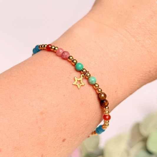 'Hot girl summer' gold vermeil dainty beaded bracelet with tigers eye, turquoise, apatite, carnelian and rhodochrosite. With a beautiful open star charm.Made with round 3mm gold vermeil beads and 4mm smooth and faceted round crystal gemstone beads. Pictured being worn.