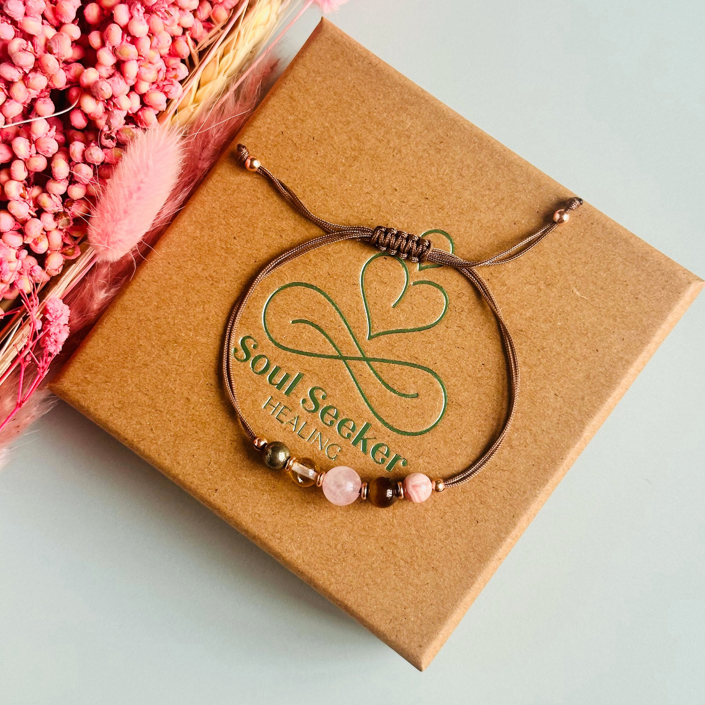 Cord bracelet made with five crystals all believed to help with self-confidence. Including pyrite, citrine, rose quartz, tigers eye and rhodochrosite. With your choice of cord colour and choice of either sterling silver, gold vermeil or rose gold vermeil accent beads.