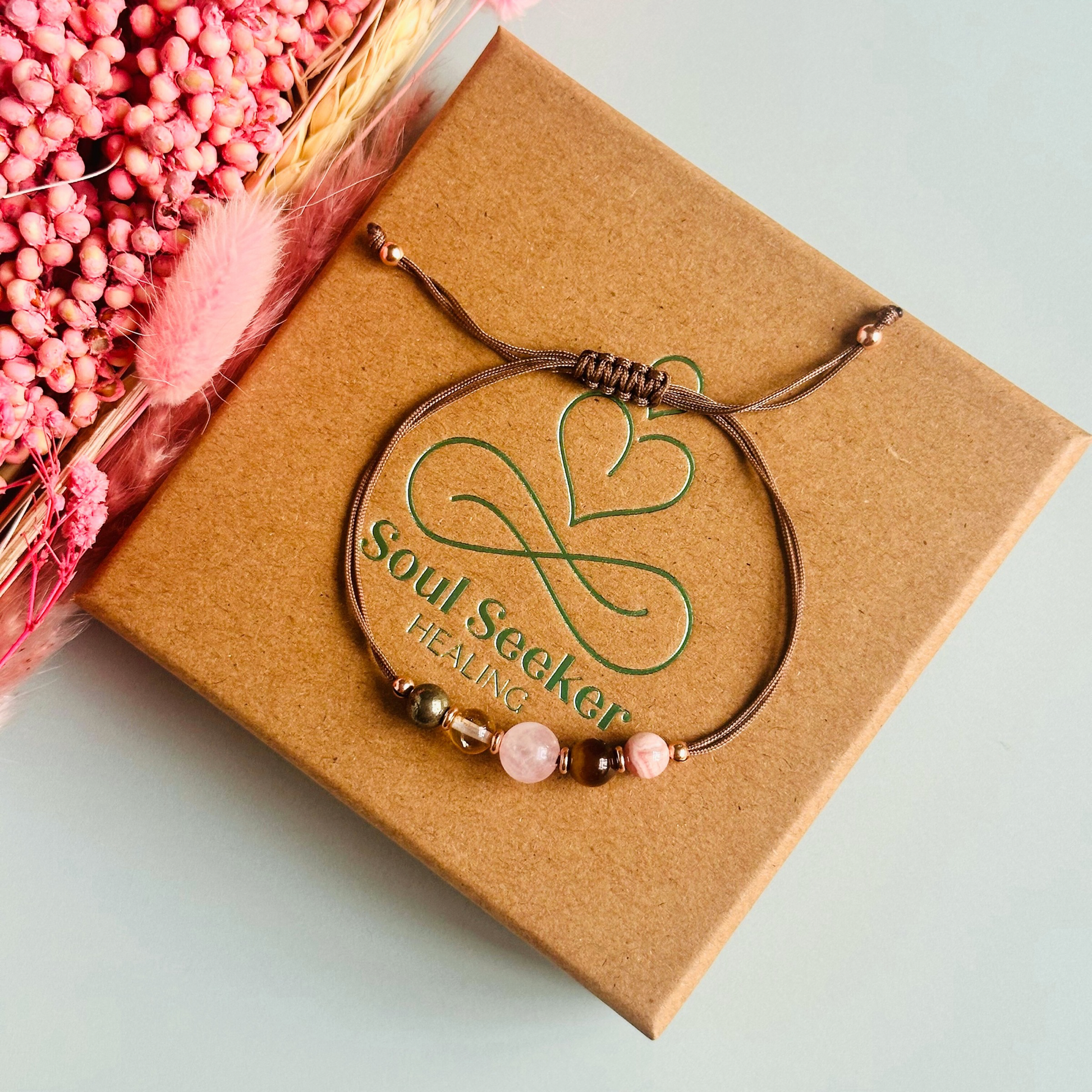 Cord bracelet made with five crystals all believed to help with self-confidence. Including pyrite, citrine, rose quartz, tigers eye and rhodochrosite. With your choice of cord colour and choice of either sterling silver, gold vermeil or rose gold vermeil accent beads.