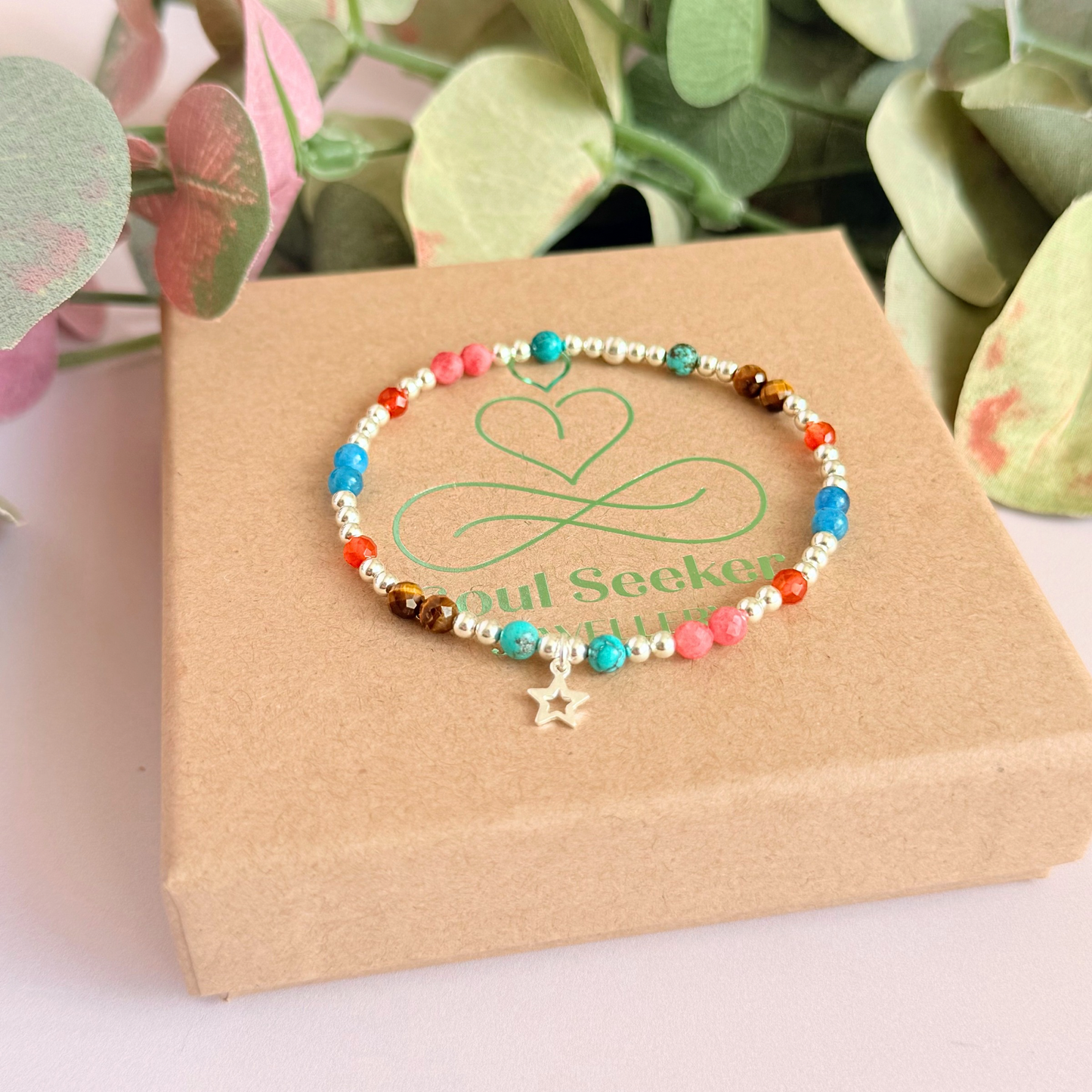 'Hot girl summer' sterling silver dainty beaded bracelet with tigers eye, turquoise, apatite, carnelian and rhodochrosite. With a beautiful open star charm. Made with round 3mm sterling silver beads and 4mm smooth and faceted round crystal gemstone beads. Pictured on the gift box.
