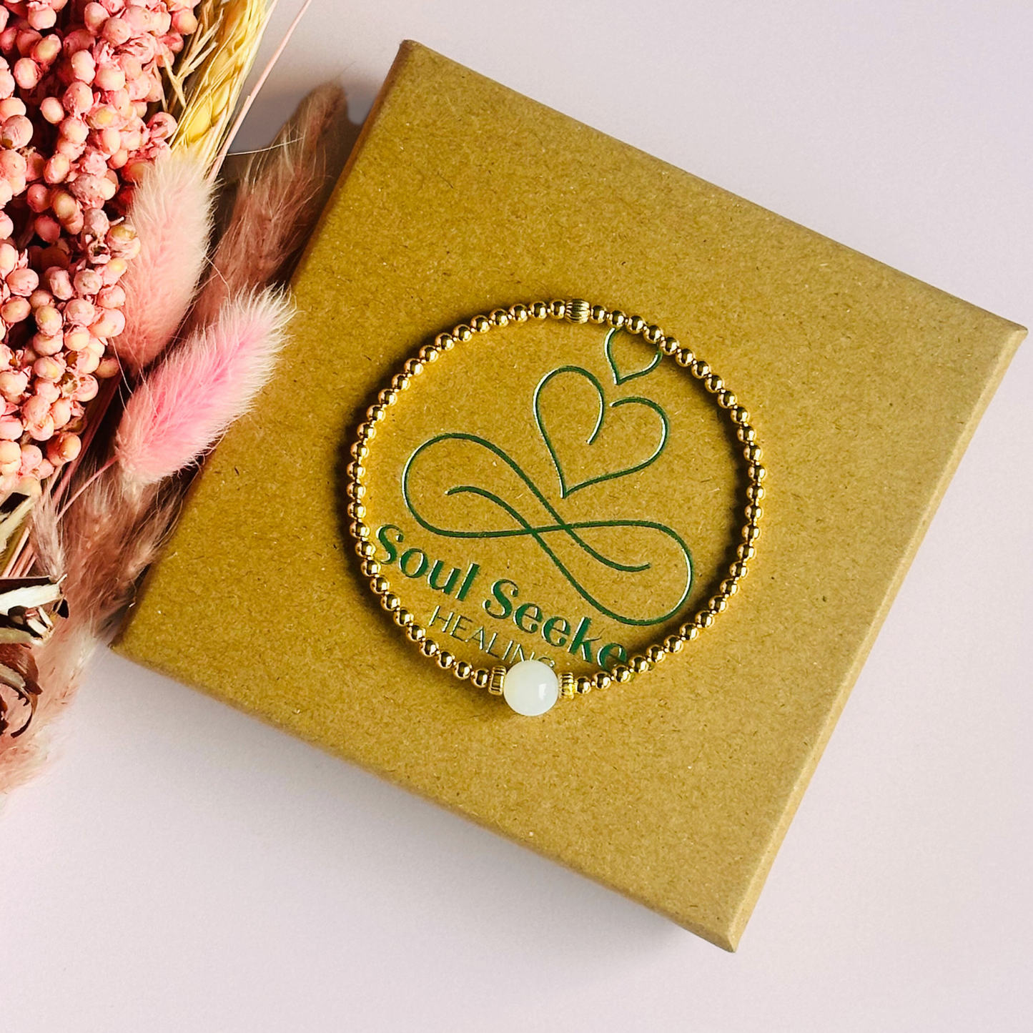 Gold vermeil moonstone bracelet features an ethically mined 8mm moonstone bead, flanked by corrugated rondelle beads on a band of 3mm gold vermeil beads. A bracelet to promote feminine energy and intuition.
