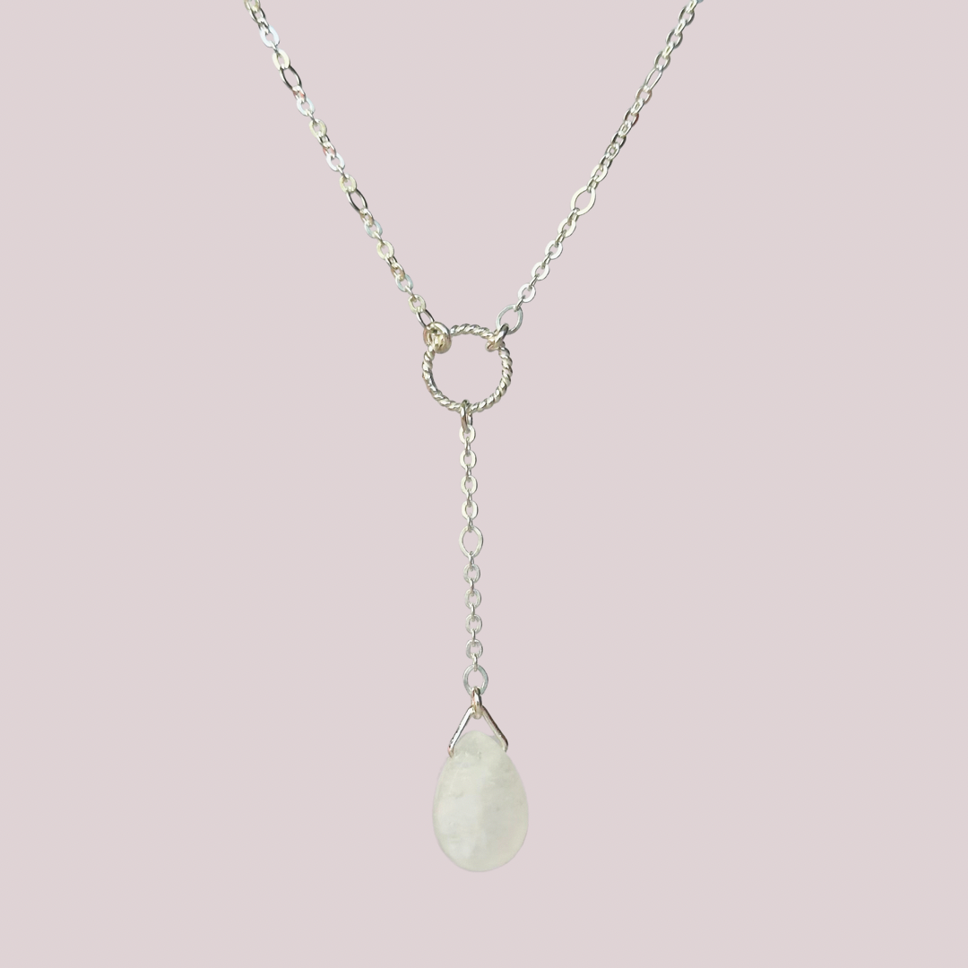 Moonstone necklace features a faceted moonstone teardrop bead on a delicate sterling silver figaro chain with a twisted sterling silver ring focal point. The necklace fastens with a subtle yet secure sterling silver bolt clasp. The teardrop bead measures 12mm x 8mm.