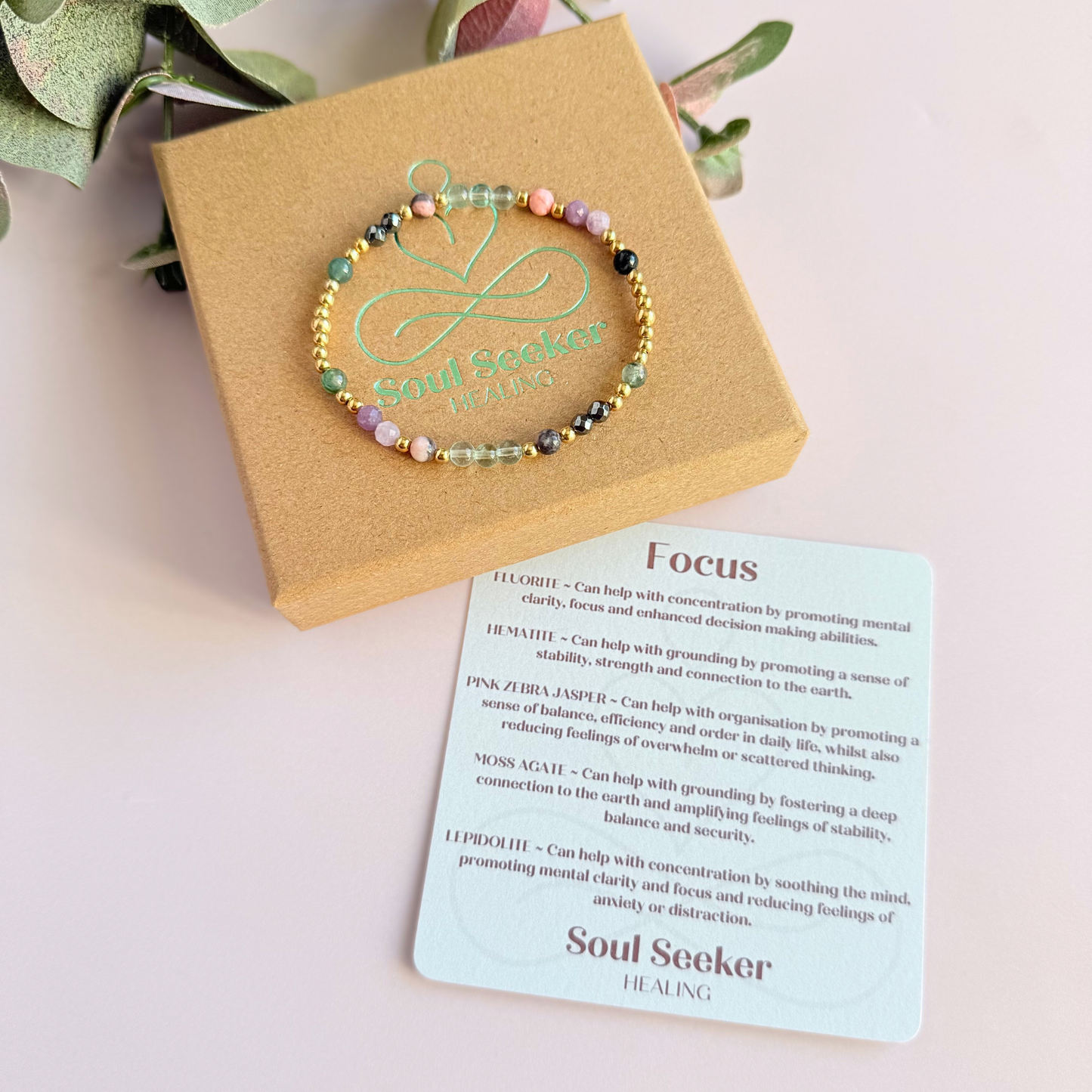 Dainty crystal bracelet featuring five crystals all believed to help with focus, clarity and overwhelm. Featuring fluorite, hematite, lepidolite, moss agate and pink zebra jasper. Featuring 3mm gold vermeil round beads and 4mm faceted round and smooth round crystal beads. ￼ pictured on top of the gift box with the crystal information card.