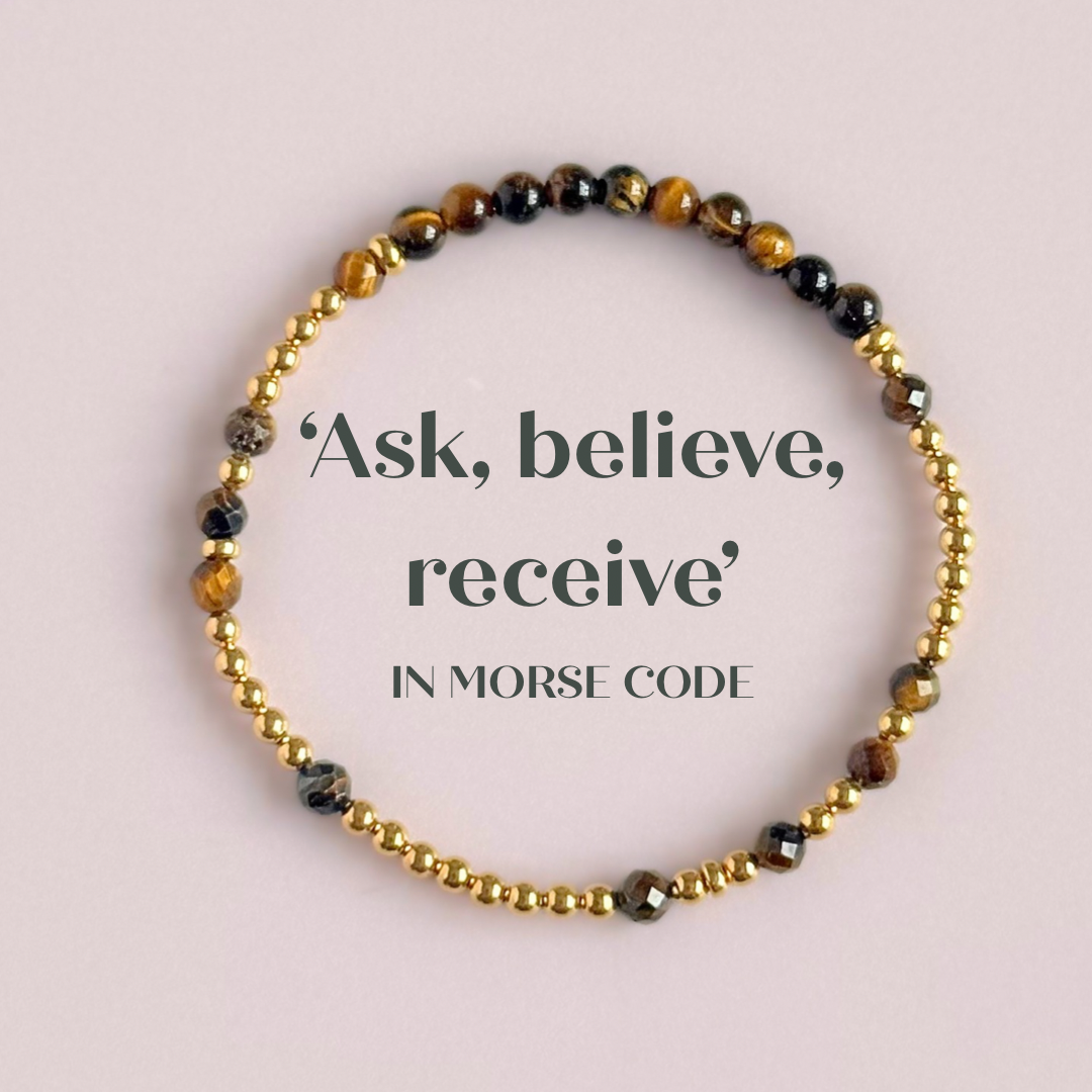 Tigers eye morse code bracelet that spells out the words ‘Ask, believe, receive’ in a combination of 4mm round smooth and faceted crystal beads with your choice of sterling silver or gold vermeil accent beads. Pictured in gold, from above