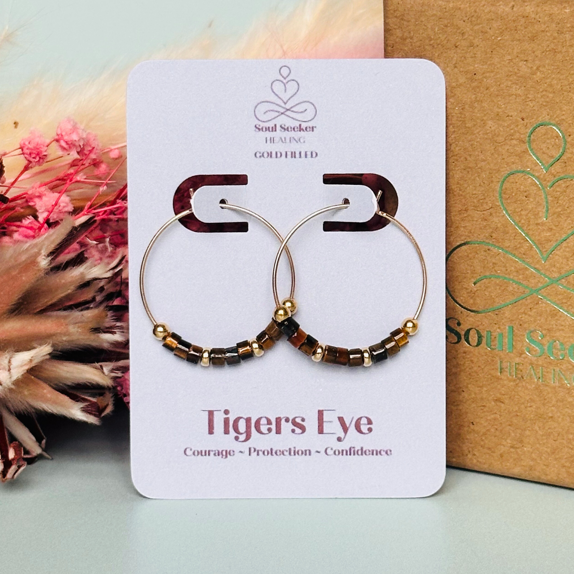 Tigers eye gold filled hoop earrings with ethically mined tigers eye heishi beads on 25mm gold filled hoops.