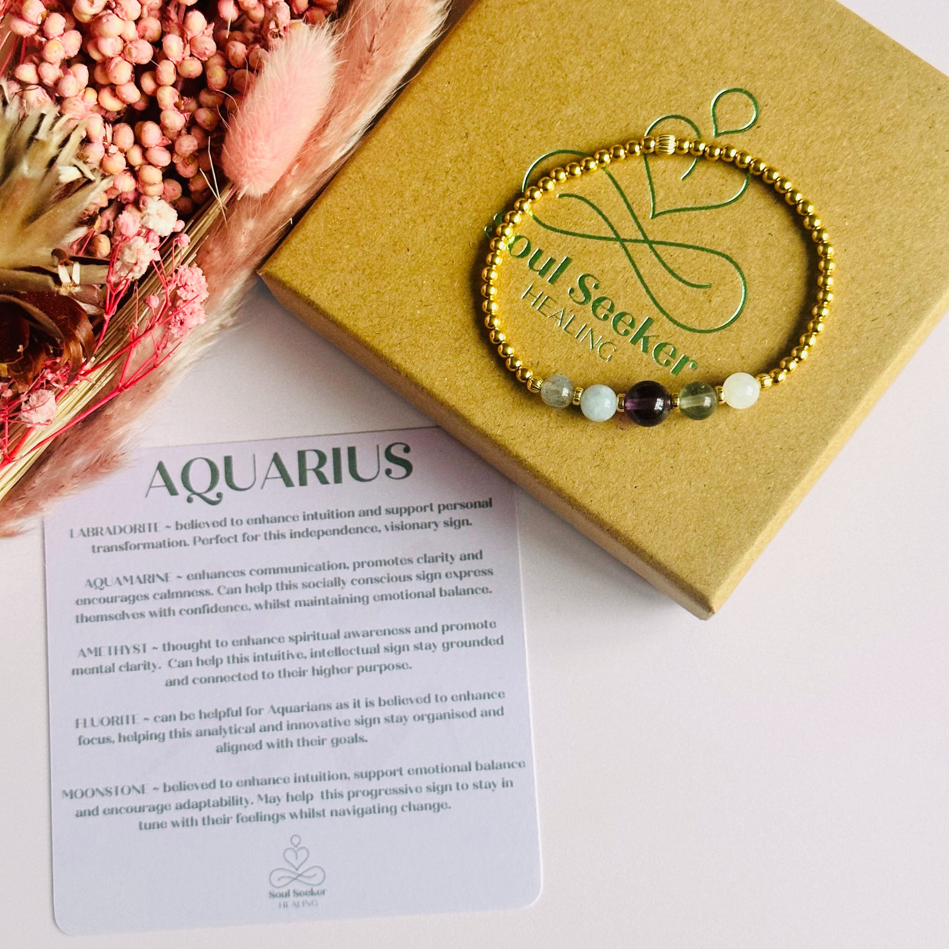 This gold vermeil Aquarius bracelet is made with a selection of five healing crystals all believed to resonate with the Aquarius zodiac sign. The central bead is 8mm, the other four are 6mm. On an elasticated band of 3mm gold vermeil beads with corrugated accent beads. Featuring labradorite, moonstone, fluorite, amethyst and aquamarine.